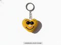 “Sunny Smiley Heart Charm – Handmade Pocket of Joy”